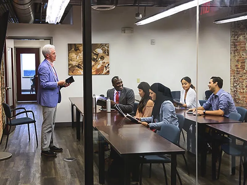 Penn State students in a business conference room