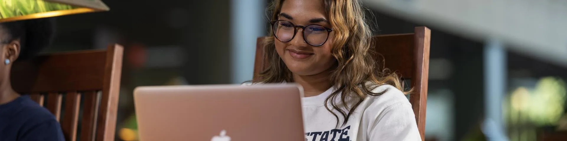 Student working at a laptop