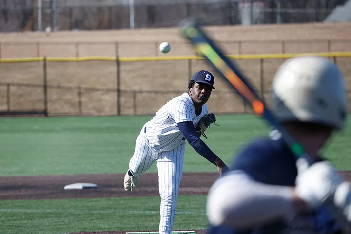 Photo of a pitcher on the Brandywine baseball team pitching toward a waiting batter