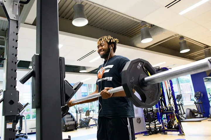 student lifting weights