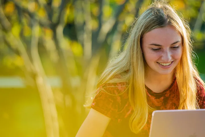 Photo of student with laptop