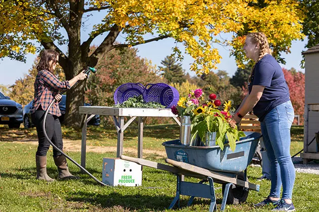 Photo of students working at the student farm