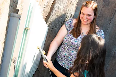 Photo of students interacting outdoors