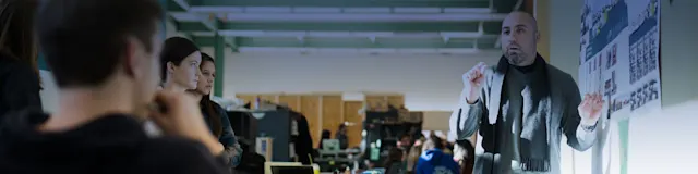 Faculty member teaching students in a classroom