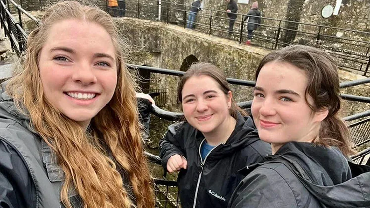 Photo of students smiling in a selfie while studying abroad