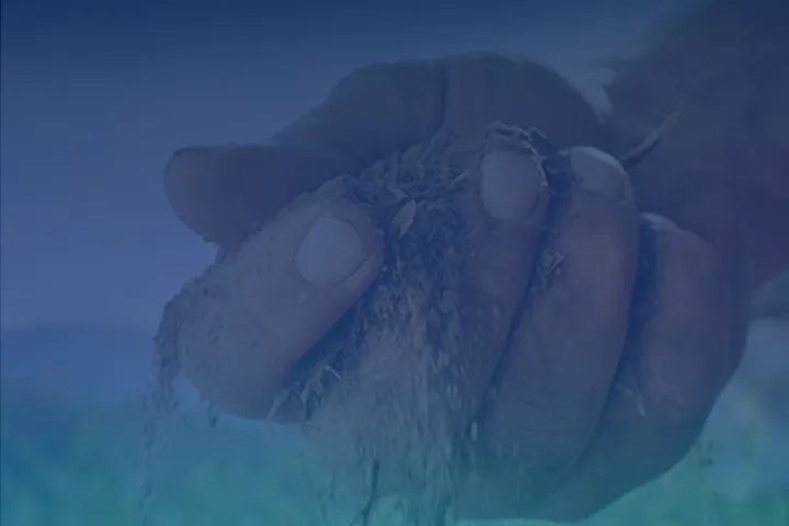 Close-up photo of a hand full of soil