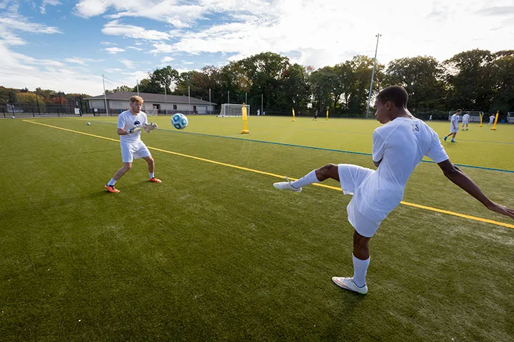 Photo of two Abington students playing soccer