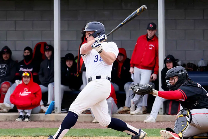 Photo of a batter on the Penn State Berks baseball team swinging at the plate