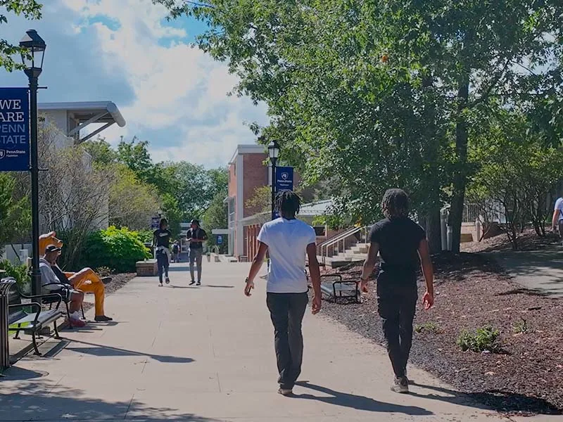 A two people walking on campus at Penn State Hazleton.