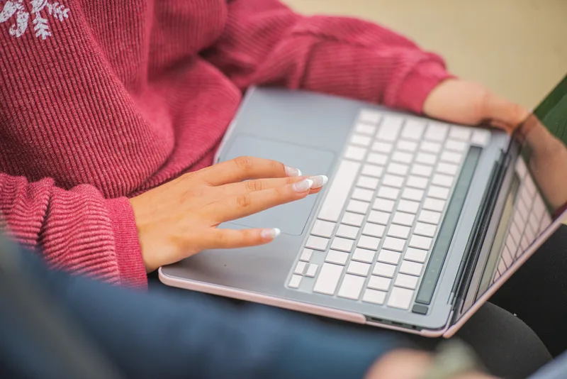 Person typing on laptop computer