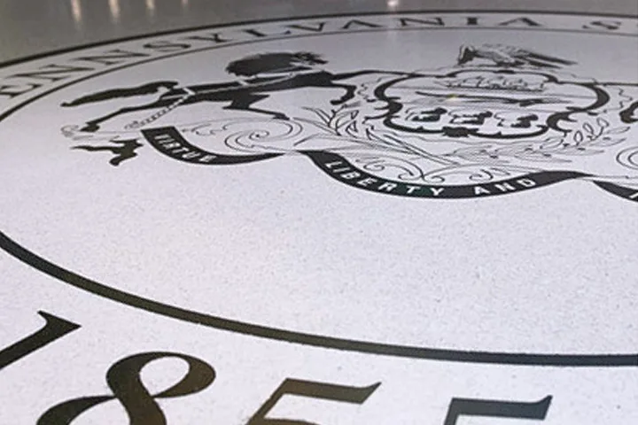 Photo of the University seal on the floor of the HUB