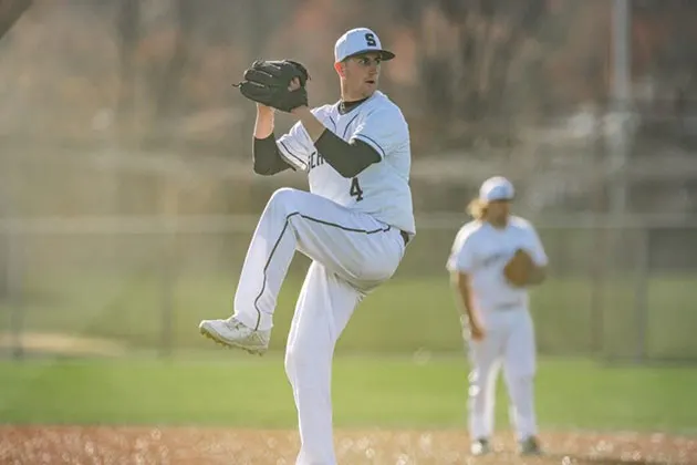 Photo of player pitching during a baseball game