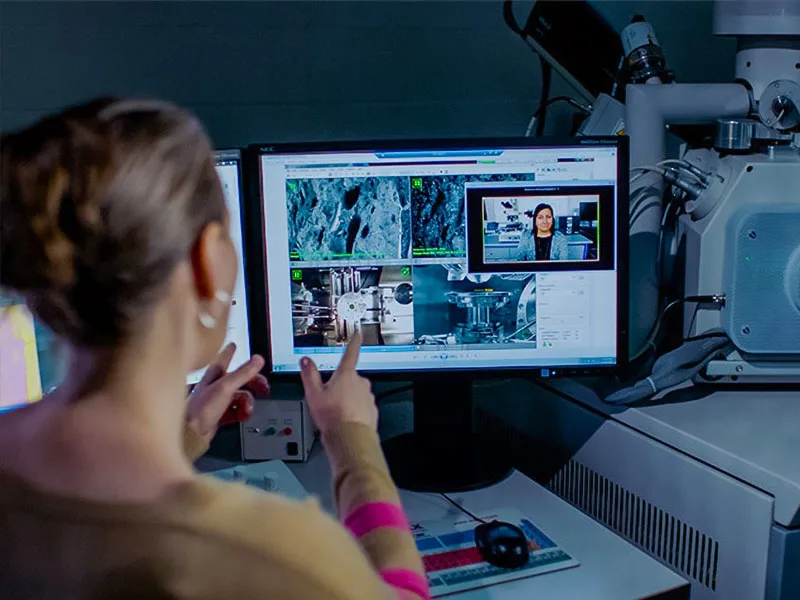 Photo of student at their desk on a video call