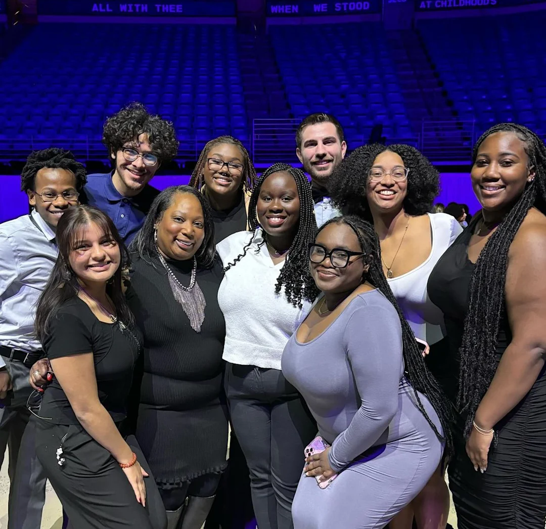 Group of students and staff smiling during Achievers event