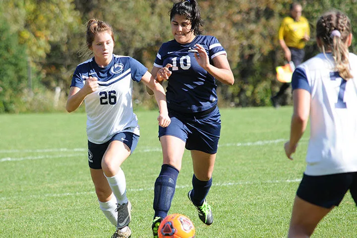Photo of a Scranton women's soccer players competing in a game