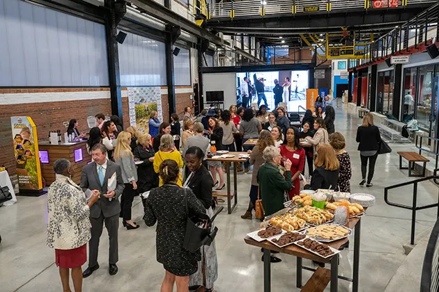 A student and industry networking event in a large room