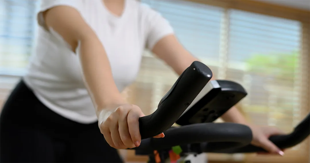 Torso of person on an exercise bike