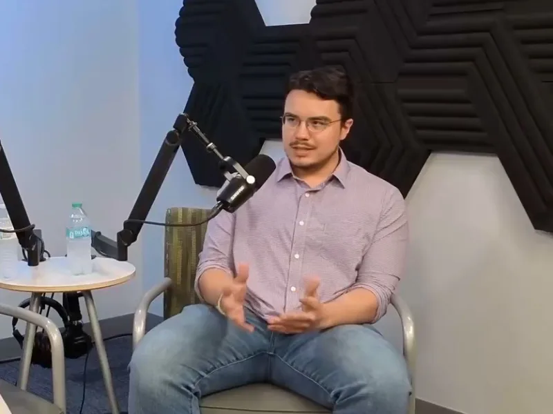 3 students in podcast studio