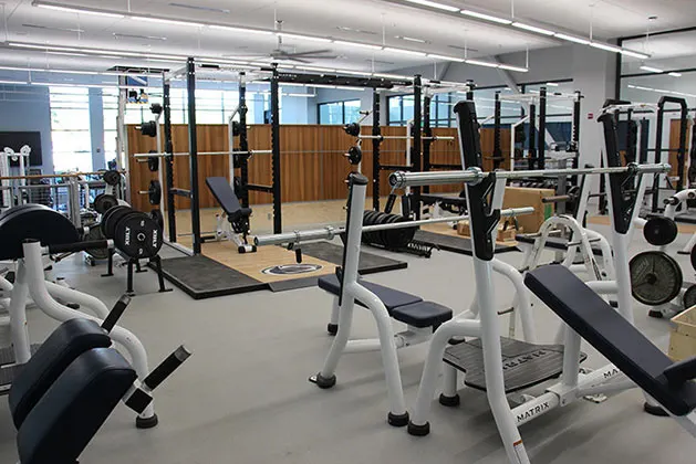 Photo of exercise and weight equipment inside the Athletics and Wellness Center