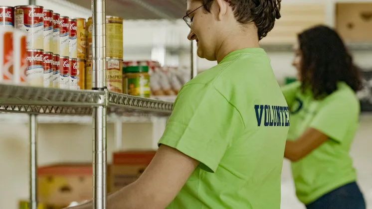 Photo of student volunteers working in a food bank
