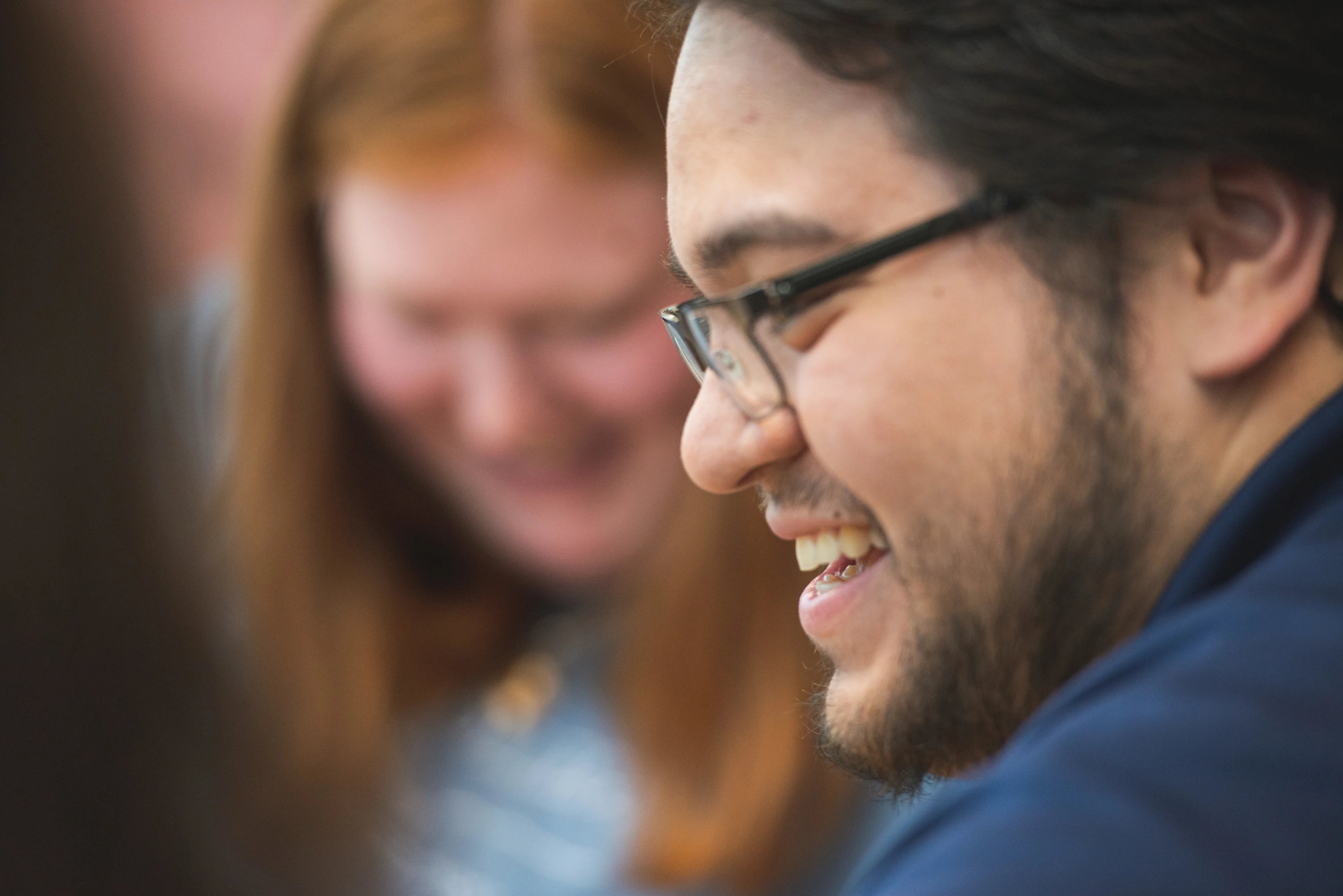 Smiling students in profile.