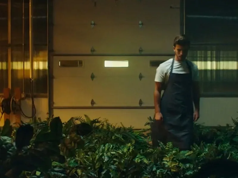 Photo of a student in a greenhouse