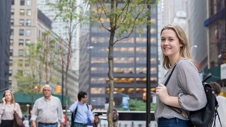 Photo of a student on a city street