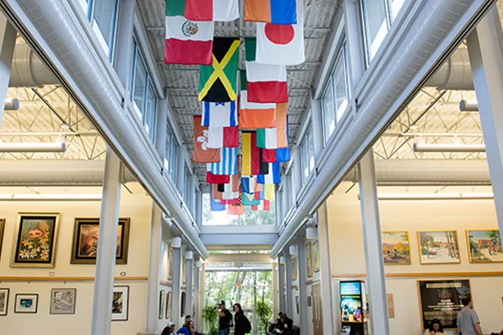 Photo of building interior displaying flags of countries