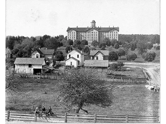 A black and white picture of a college campus taken in the 1800s