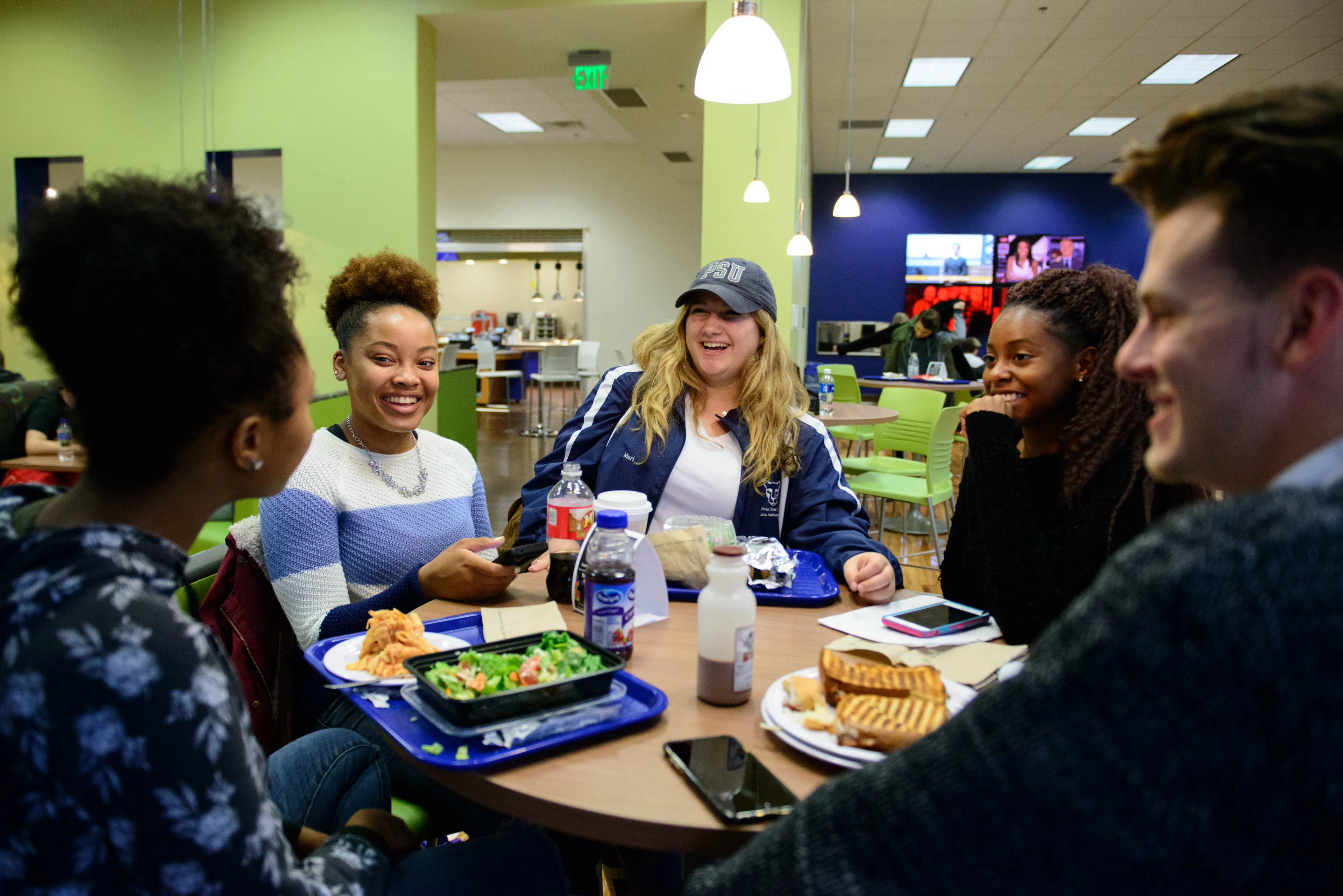 Students at dining hall table.