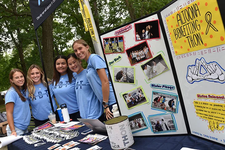 Photo of students representing THON at an involvement fair table