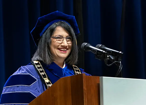Neeli Bendapudi speaking in regalia at commencement