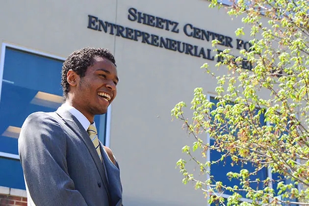 Photo of a student in from of the Sheetz Center