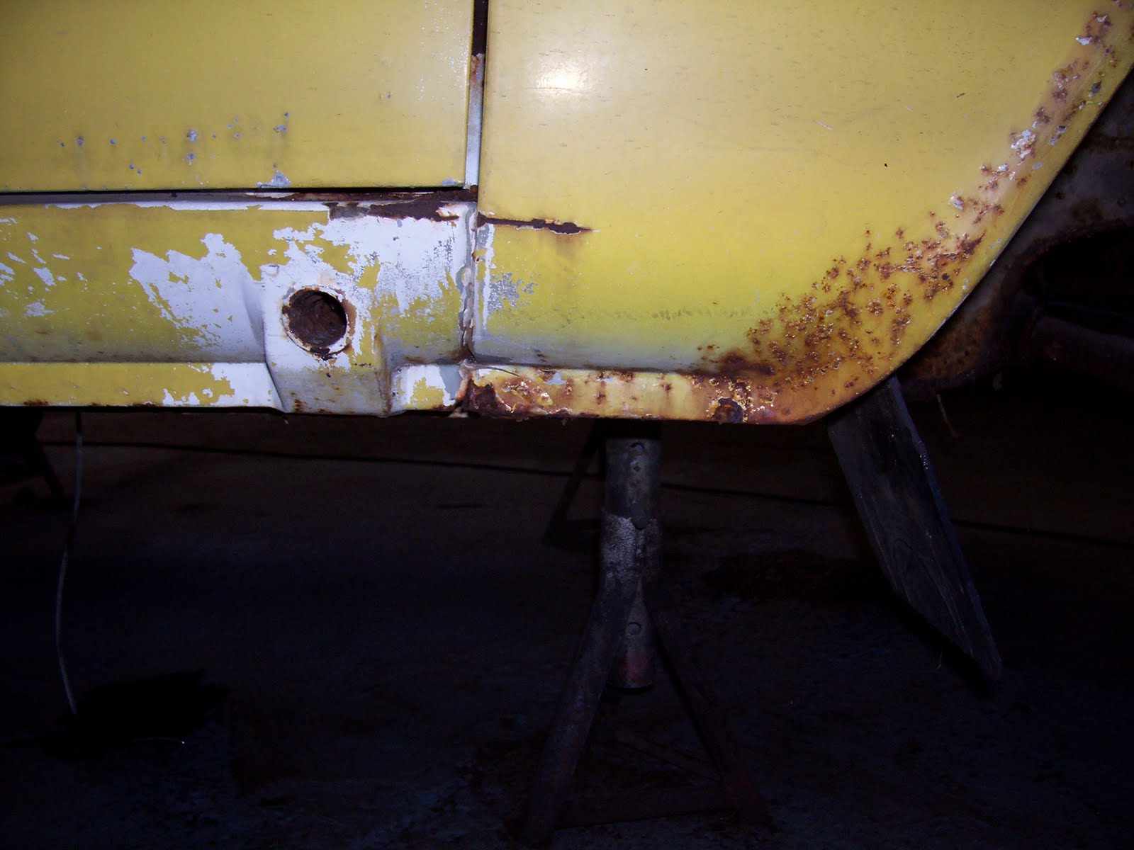 Jacking point detail, and corrosion evident on aluminium doorskin. Jacking point detail, and corrosion evident on aluminium doorskin.