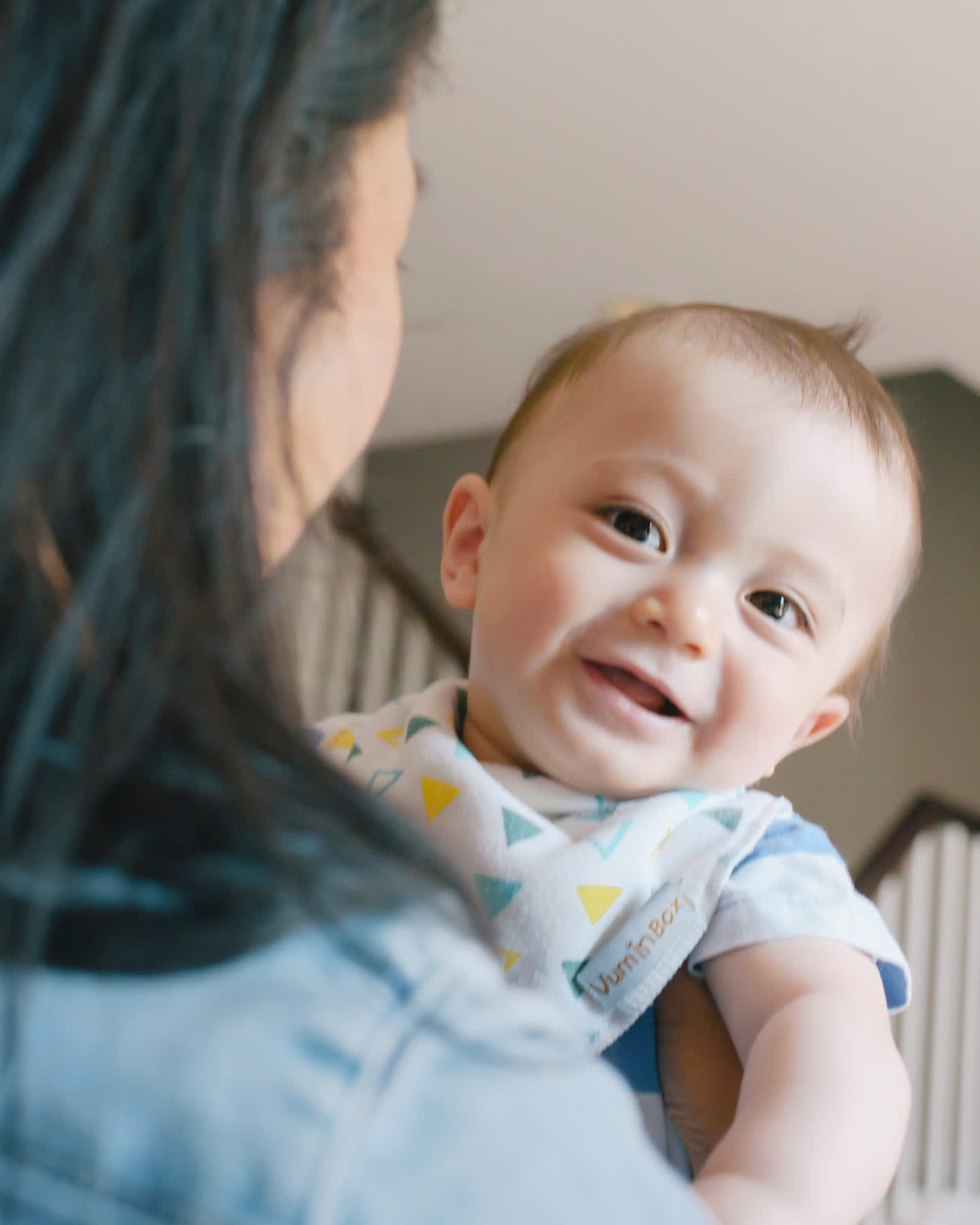 covid-19-response-header-of-baby-smiling-and-looking-over-mothers-shoulder