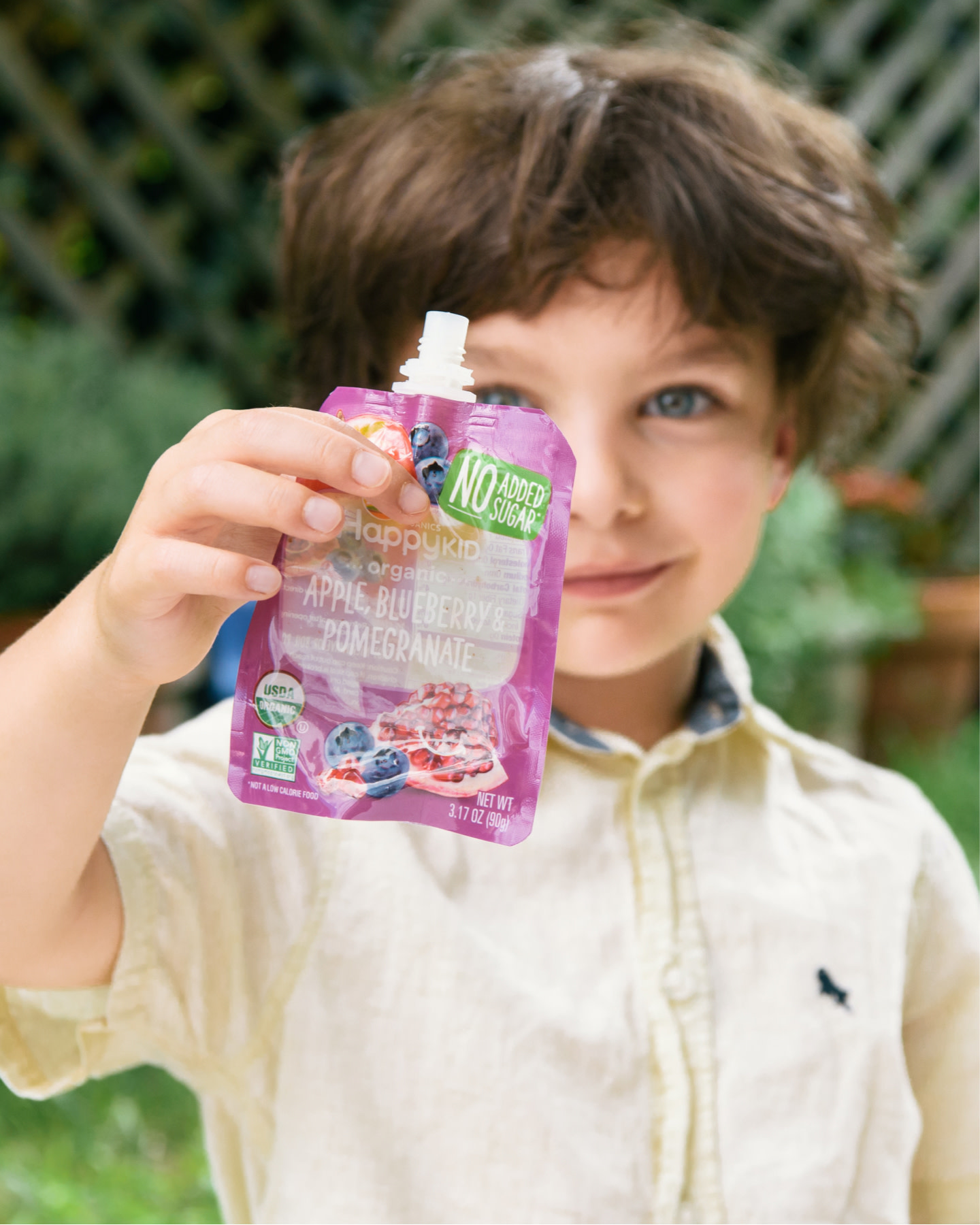 Kid Pouches header of boy holding up empty pouch