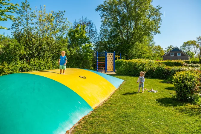 Toddlers friendly holidays - playground with air trampoline for young kids at holiday park EuroParcs IJsselmeer