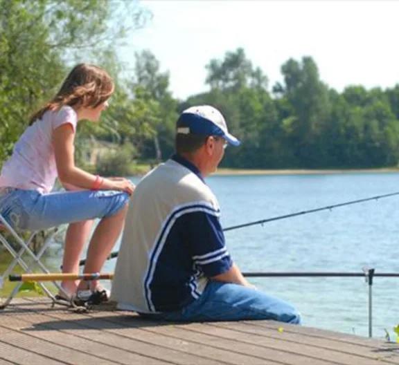 Fishing holiday with father and daughter by the water