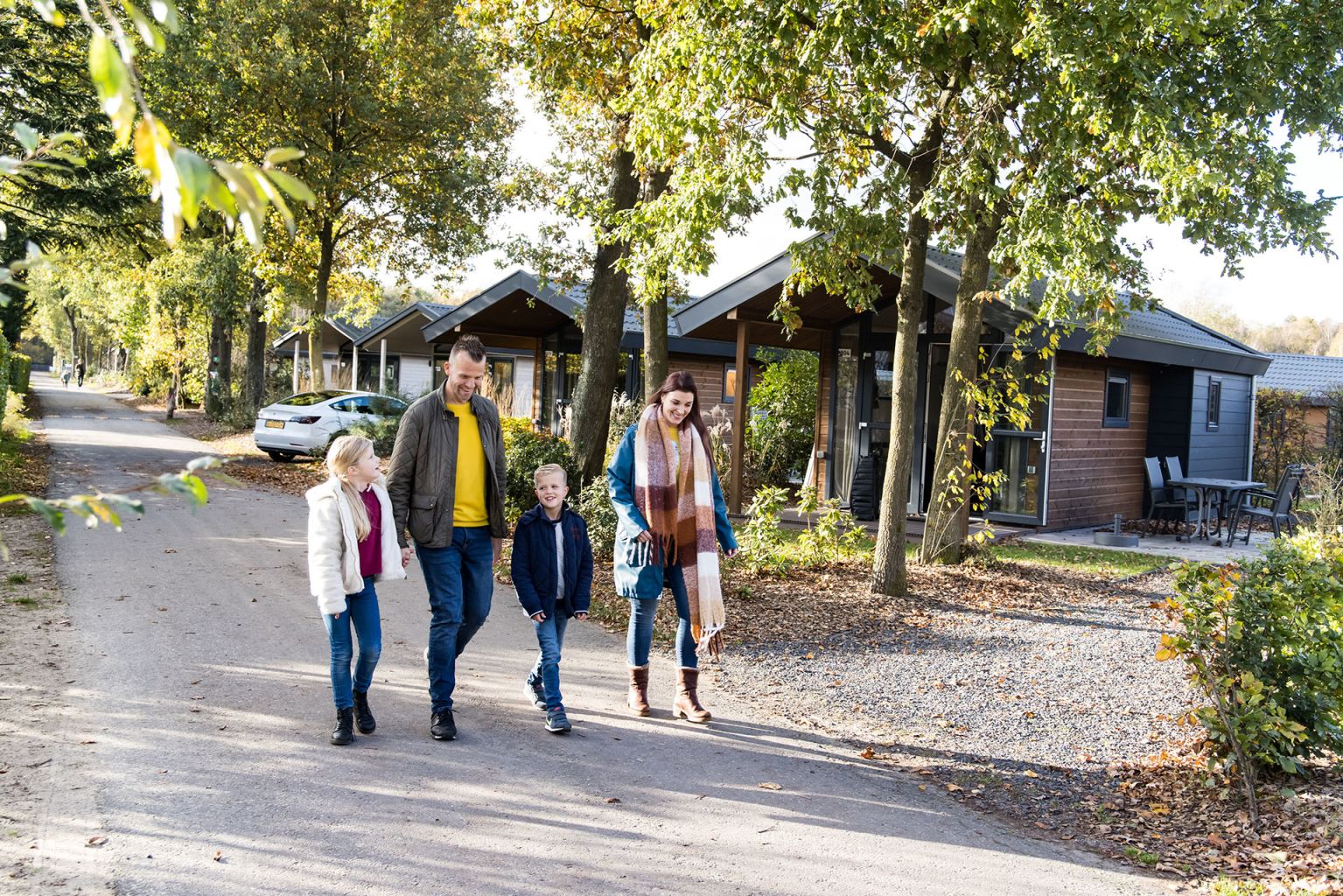 family walking on the park autumn