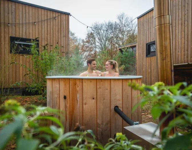 Babymoon - pregnant on holiday, pregnant couple in the hot tub at holiday park EuroParcs De Hooge Veluwe
