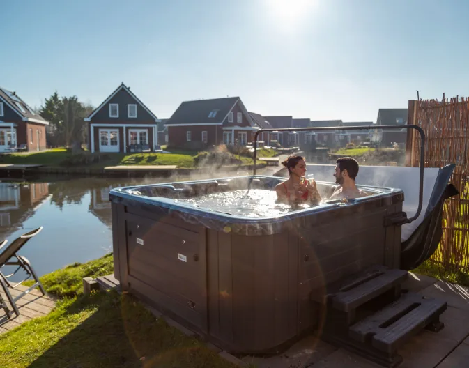 EuroParcs IJsselmeer Jacuzzi Couple Cheers Romantic Wellness Villas