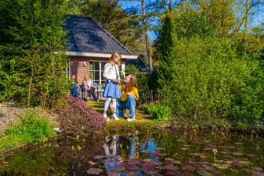 Family at the pond EuroParcs Beekbergen