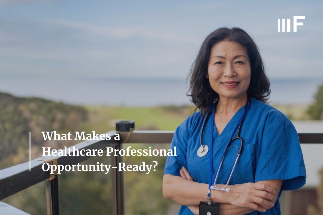 Photograph of an asian woman in bright blue scrubs with a stethoscope around her her neck smiling from a balcony overlooking green and blue countryside - overlayed with the text, "What makes a healthcare professional opportunity-ready?"