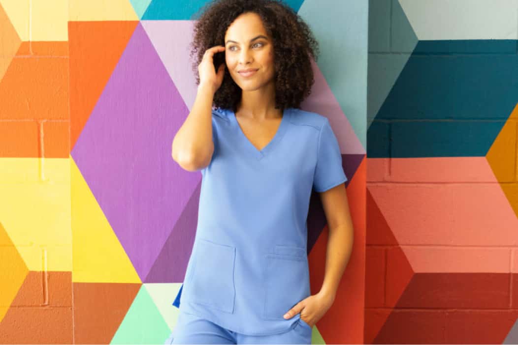 Trustaff travel nurse in front of colored wall