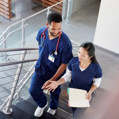 2 travel nurses conversing between work