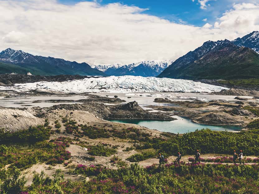 Image showing snow-capped mountains reflected in a pristine lake in Alaska.