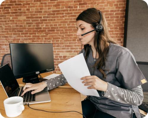 A prior authorization nurse enters data into her computer
