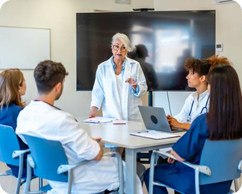 A quality improvement specialist speaks to a room of healthcare professionals