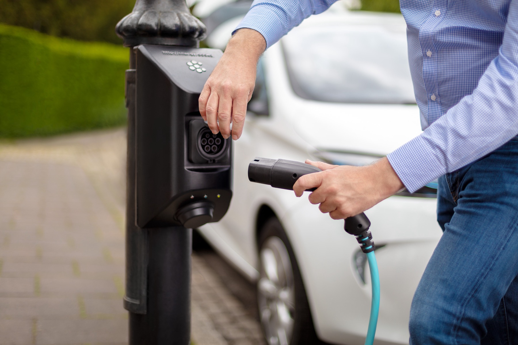 A photograph of someone using a char.gy charge point