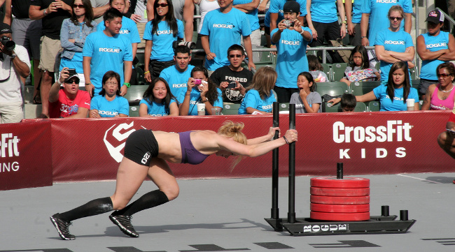 Annie Thorisdottir pushing a sled